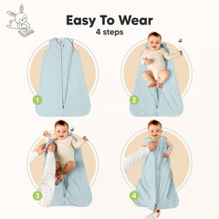 Baby wearable blanket with ergonomic armholes and hip room for natural movement
