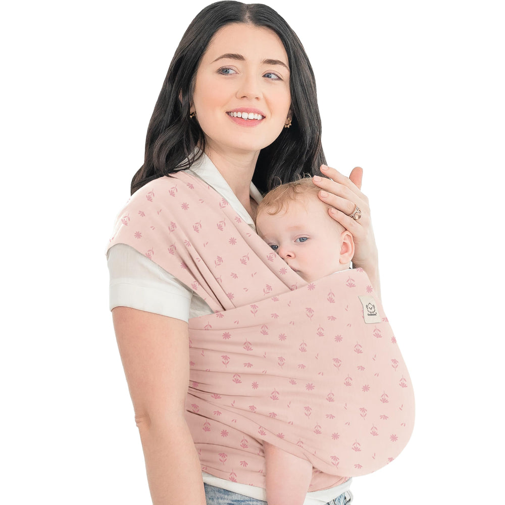 KeaBabies Baby Wrap Carrier Pink Daisies in use for secure babywearing