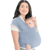 KeaBabies baby wrap carrier in powder blue worn for on-the-go comfort