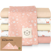 KeaBabies butterfly-pattern burp cloth catching spit-ups during feeds
