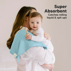 KeaBabies Lumi burp cloth on baby for gentle cleanup after feeding.