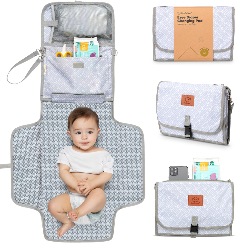 KeaBabies portable changing pad attached to stroller handle for hands-free diaper changes.