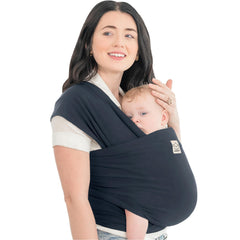 KeaBabies Midnight wrap worn on body with baby in sling for hands-free bonding.