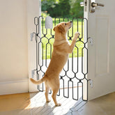 KEVLTROV metal retractable door barrier mounted on front door for secure pet containment.