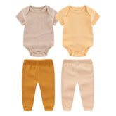 Kiddiezoom newborn layette bodysuits close-up, soft cotton for delicate daily wear.