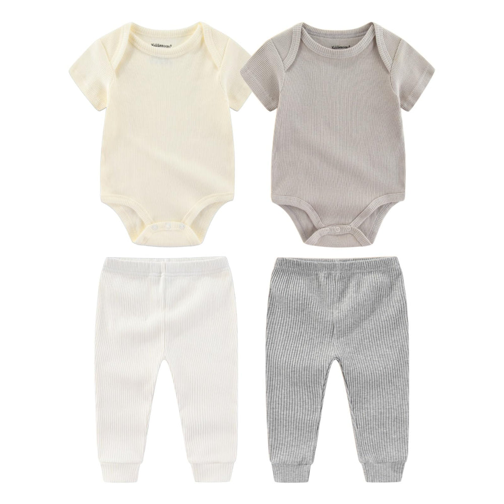 Kiddiezoom newborn layette bodysuits closeup, soft cotton for delicate skin.