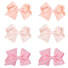 KIDOCHEESE baby hair bows clip set in three colors for secure all-day wear.