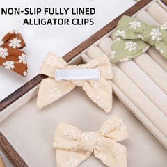 Kidocheese ivory grosgrain covered clip protects delicate hair while staying put.