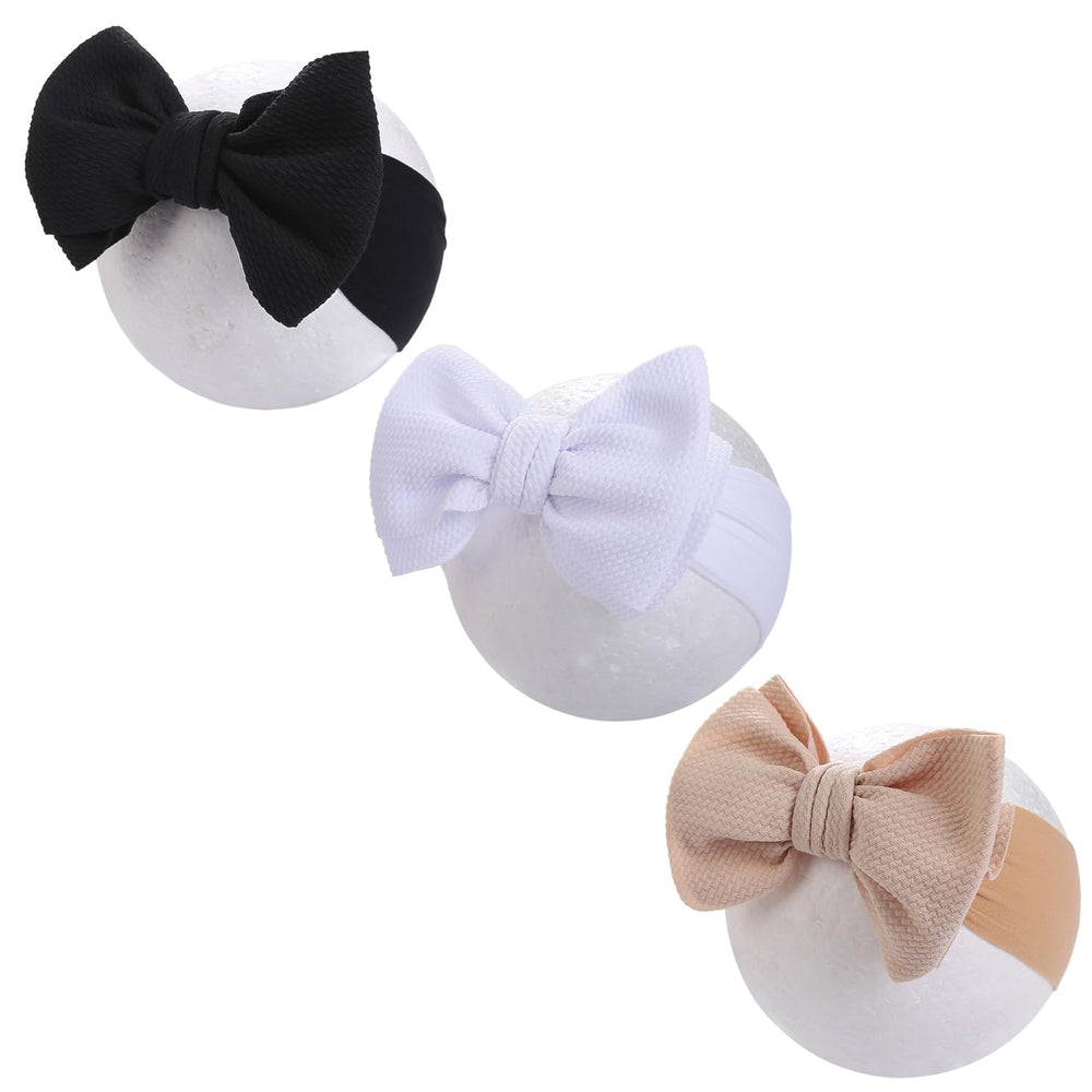KIDOCHEESE Big Bows with stretchy nylon headbands offer soft, comfortable wear for newborns.