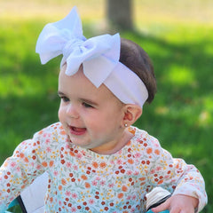 KIDOCHEESE elastic nylon hairband offers a soft, comfortable fit.