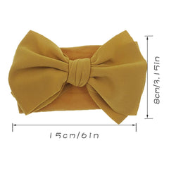 KIDOCHEESE hairband demonstrating adjustable size for infant to toddler.