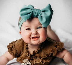 KIDOCHEESE hairband styled for baby shower photographs.