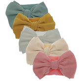 KIDOCHEESE hairband with soft nylon bow for comfortable baby wear.