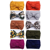 KIDOCHEESE oversized nylon head wrap with large bow for newborns, ideal for photos.