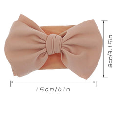 KIDOCHEESE soft nylon headband close-up showing adjustable stretch.