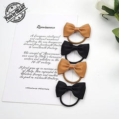 Child wearing green bows to complement outfits, suitable for daily wear.