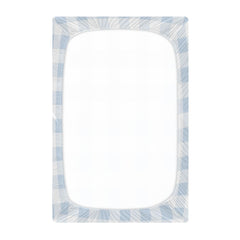 Kigai blue gingham crib sheet on toddler bed demonstrating universal fit.
