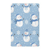 Kigai Christmas snowman crib sheet with snowflakes creates a cozy nursery ambiance.