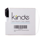 Kiinde Twist cap write-on labels with dispenser for easy breast milk labeling.