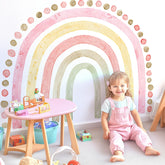 Kingarch large pink rainbow wall decal in a bright kids' room, catching soft light for a cheerful vibe.