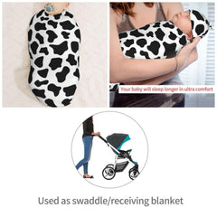 KiuLoam cow-print hat completes the newborn set.