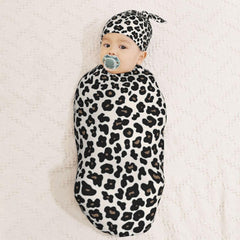 KiuLoam leopard-pattern fabric closeup showing soft, skin-friendly material.