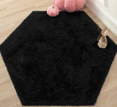 KIXINWA Black Hexagon Rug closeup showing plush surface for soft, comfortable feet
