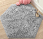 KIXINWA grey hexagon rug with plush surface, ideal for cozy playtime.