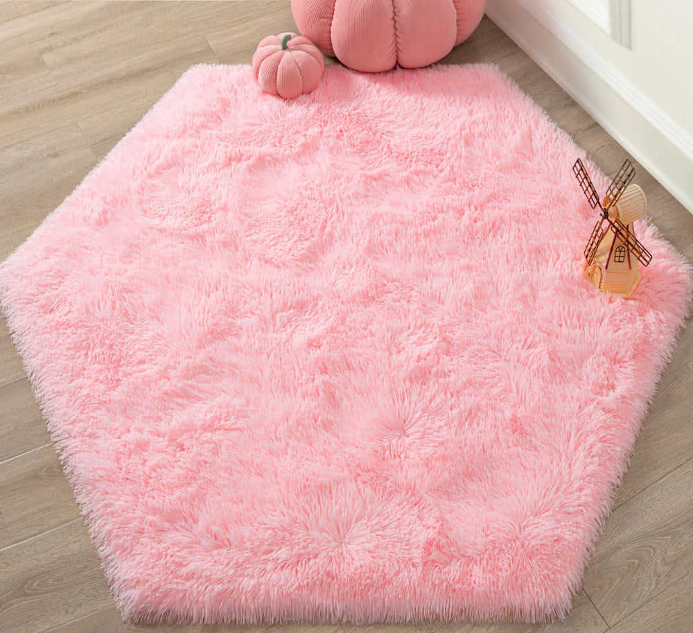KIXINWA pink hexagon princess rug with castle motif for kids' playroom.