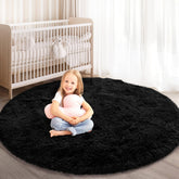 KIXINWA round rug for bedroom; fluffy surface offers soft comfort underfoot.
