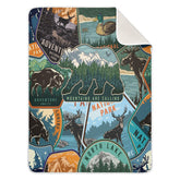 KLL baby swaddle with national park pattern closeup showing vibrant colors and soft fabric, ideal for newborn coziness.