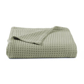 Kloovete Sage waffle weave blanket close-up, showcasing soft texture and breathability.