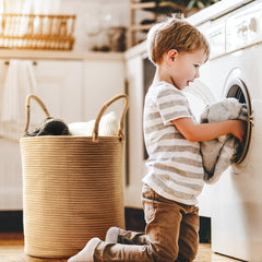 Kodomoore laundry basket in nursery decor for organized spaces.
