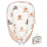 Kombi Baby Lounger Ivory front view with 360° bumpers for newborn comfort.