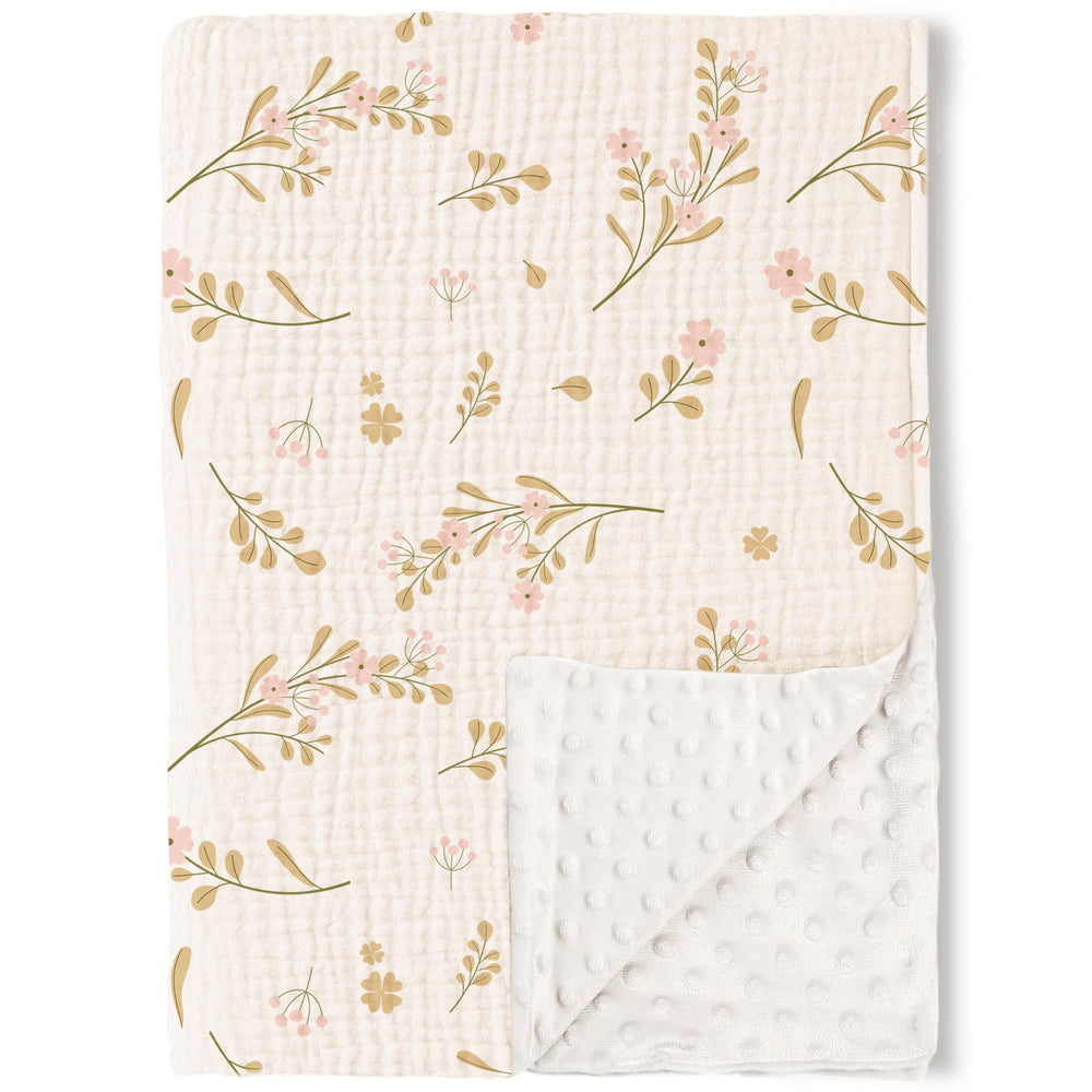 Konssy baby blanket with muslin front for gentle skin and breathability.