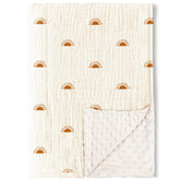Konssy baby blanket with muslin front and dotted fleece back for gentle warmth.