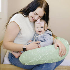 Konssy Dino Jungle nursing pillow cover with stretchy edges for a snug fit on standard pillows.