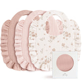 Konssy Muslin bib with pink ruffle trim offers soft skin contact and adorable styling.