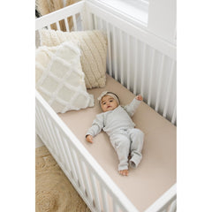 Konssy Blossom Cream muslin sheets with colorful prints for nursery style