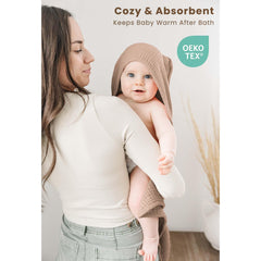 Konssy muslin hooded towel in camel keeps infants warm after bath.