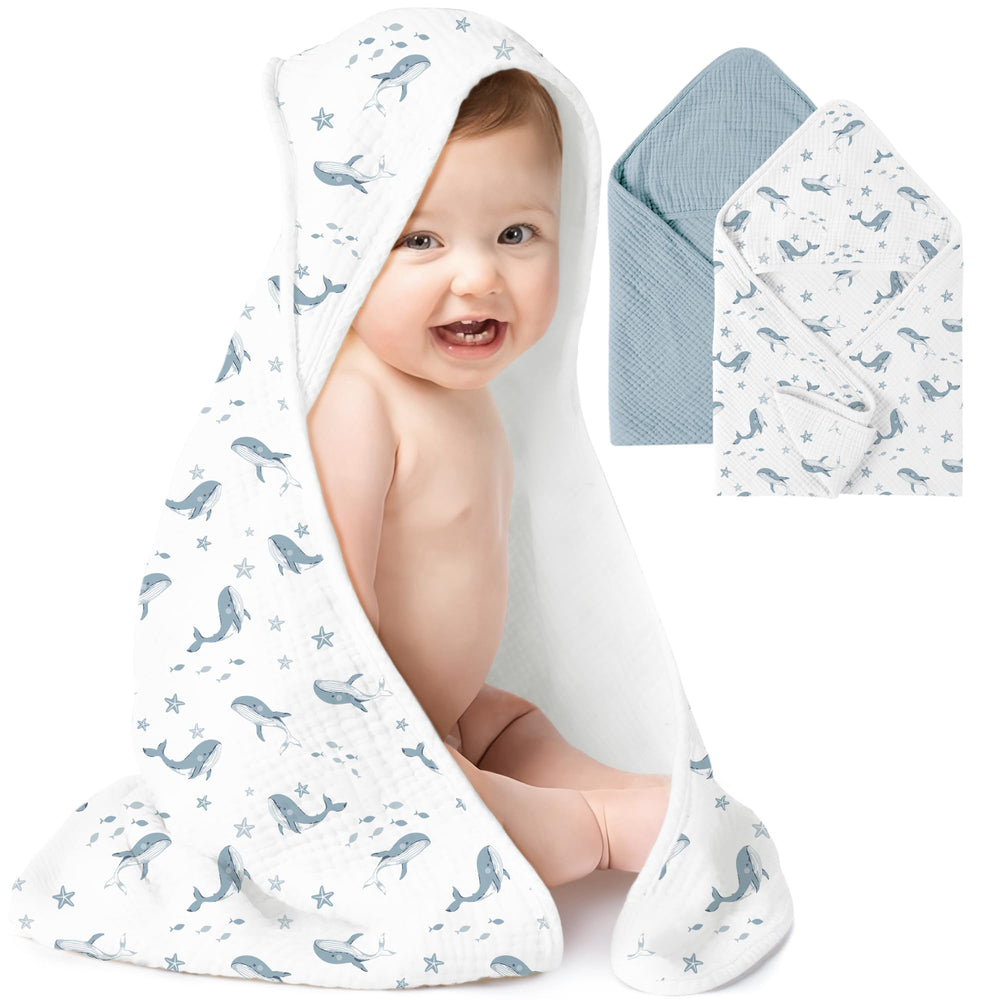 Konssy muslin hooded baby towels in blue whale design, soft and absorbent.