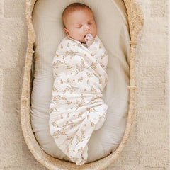 Close-up texture of Konssy muslin swaddle blanket showing lightweight cotton weave.
