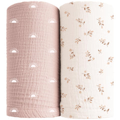 Konssy muslin swaddle blanket in pink sun folds gently for newborn comfort