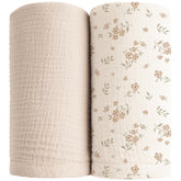 Konssy muslin swaddle blanket in soft cream for newborns, breathable and gentle.