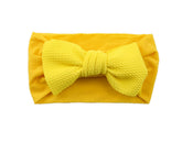 Koolgil baby girl soft bowknot headband in yellow—gentle, stretchable comfort.