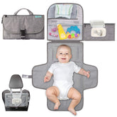 Kopi Baby portable changing pad for on-the-go diaper changes.