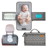 Kopi Baby portable diaper changing pad with built-in pillow offers soft on-the-go comfort
