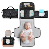 Kopi Baby portable diaper changing pad with built-in pillow for on-the-go diaper changes.