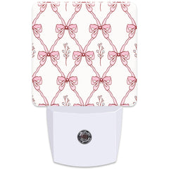 KXWQTRDD pink ribbon night light, front view with warm glow for kids' rooms