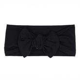 KYTE BABY bamboo bow midnight close-up with soft fabric and gentle stretch